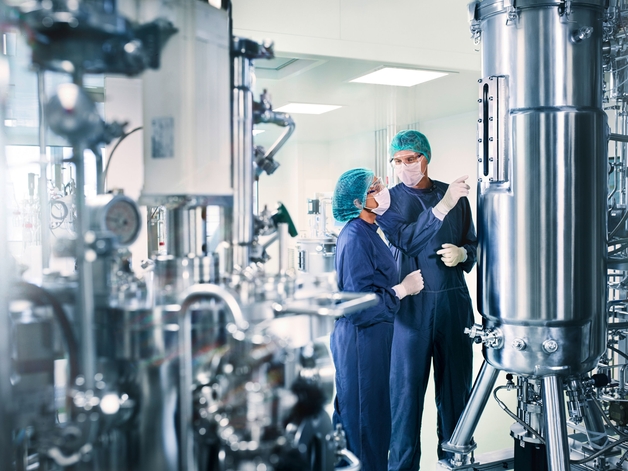 Two engineers standing in a hygienic life sciences process environment.